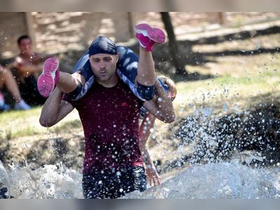 Hungarians grab their partners in nation's wife-carrying contest
