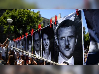 French billboard owner hit with €10,000 fine for depicting president Macron as Hitler on Covid protest poster