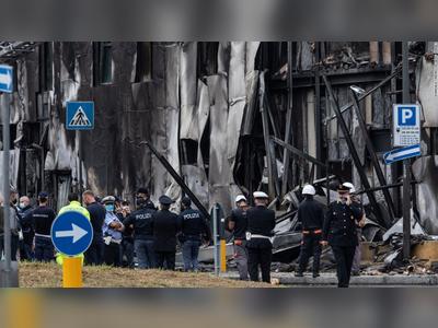 Small plane crashes into empty building outside Milan, all 8 onboard die