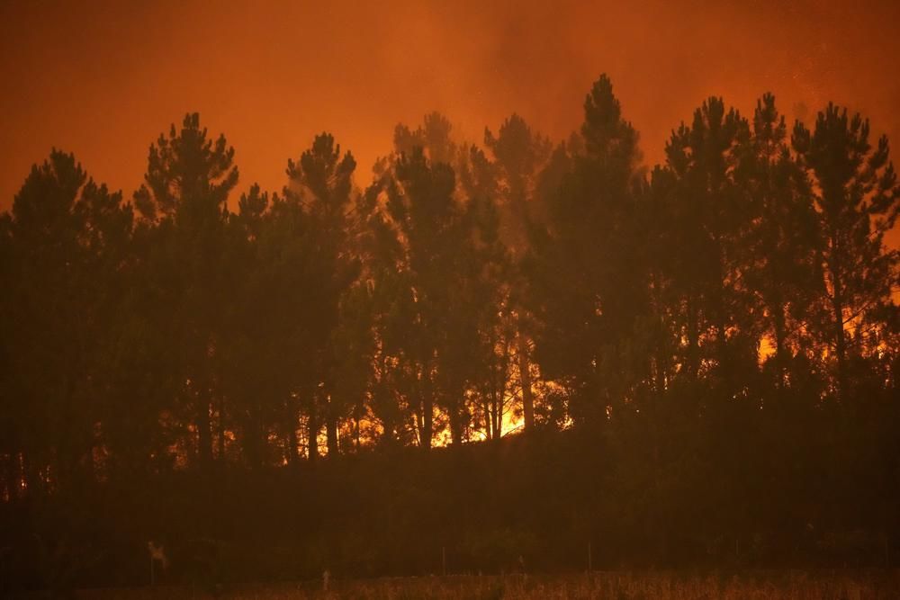 Villages battle wildfires in Portugal; Europe swelters