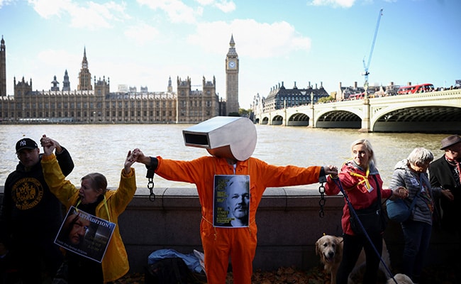 In Pics: Julian Assange Supporters Form Human Chain Outside UK Parliament