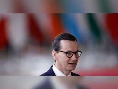 Poland waves white flag in EU rule of law dispute